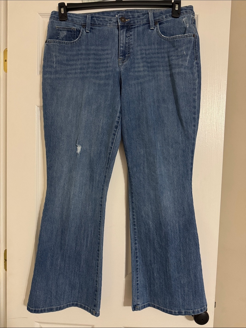 Style & Co. women’s distressed medium blue flare leg jeans